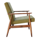 Mid-century modern armchair in olive green bouclé design by H. Lis.