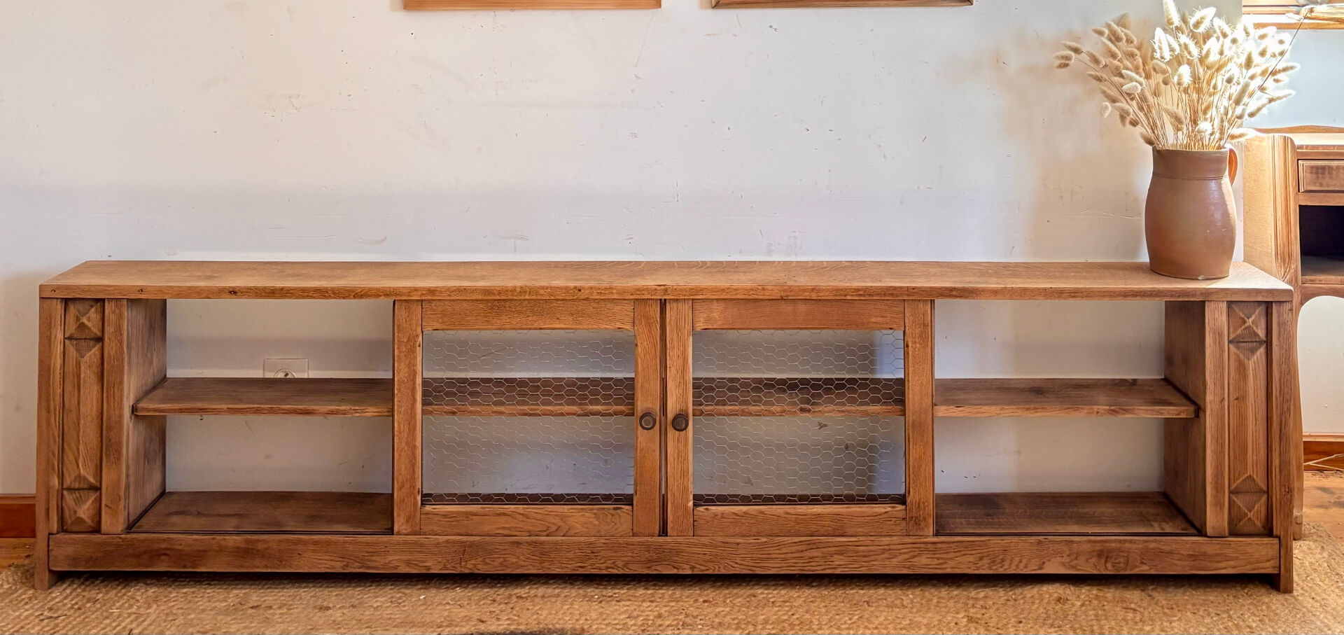 Vintage oak sideboard TV unit with sliding doors.