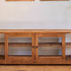 Vintage oak sideboard TV unit with sliding doors.