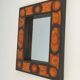 Ceramic mirror in shades of orange