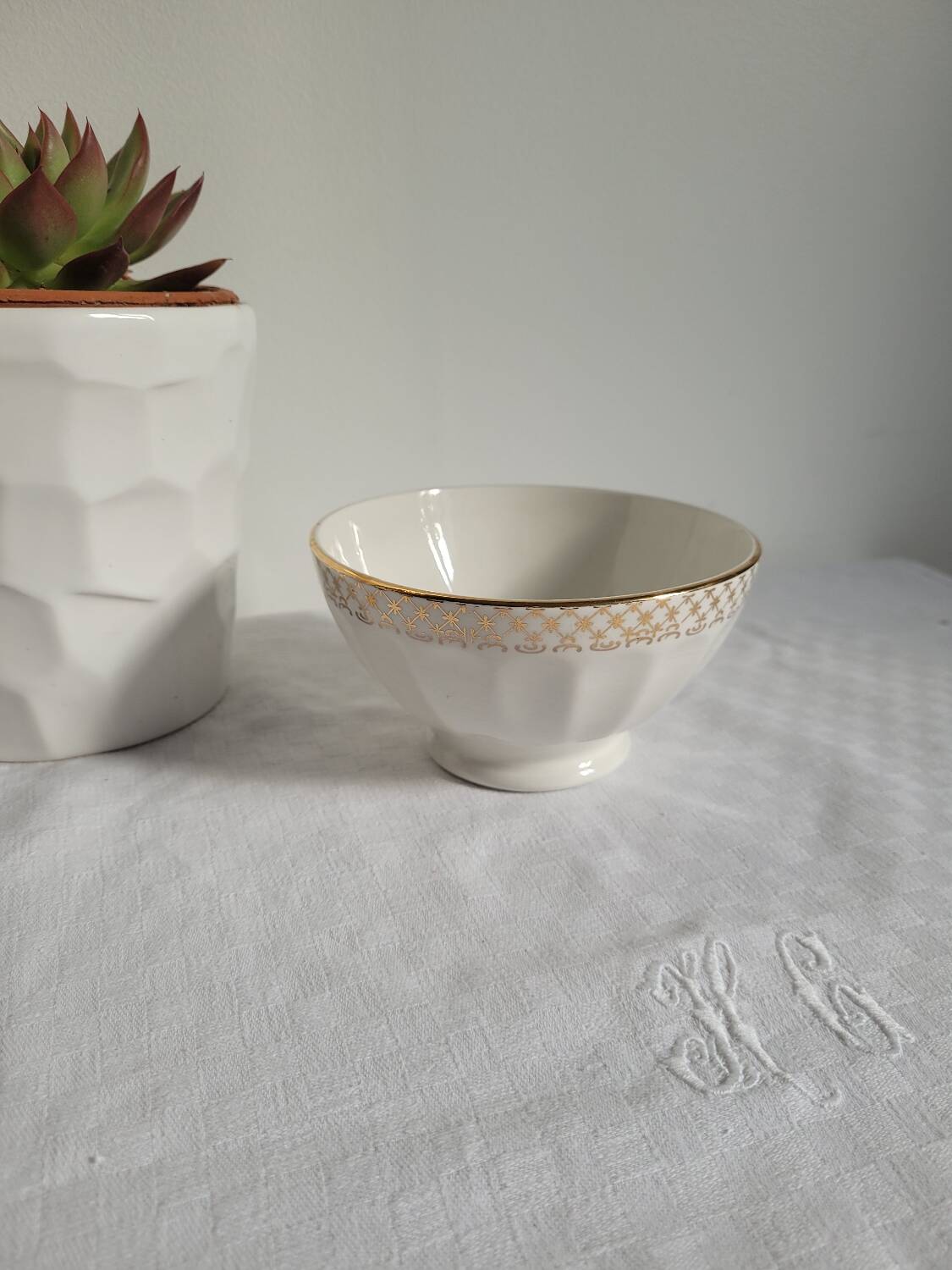 Opaque porcelain bowl with gold trim