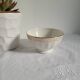 Opaque porcelain bowl with gold trim