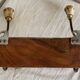 19th-century wall coat rack with 2 metal and horn hooks.