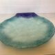 Blue glass paste pocket emptier