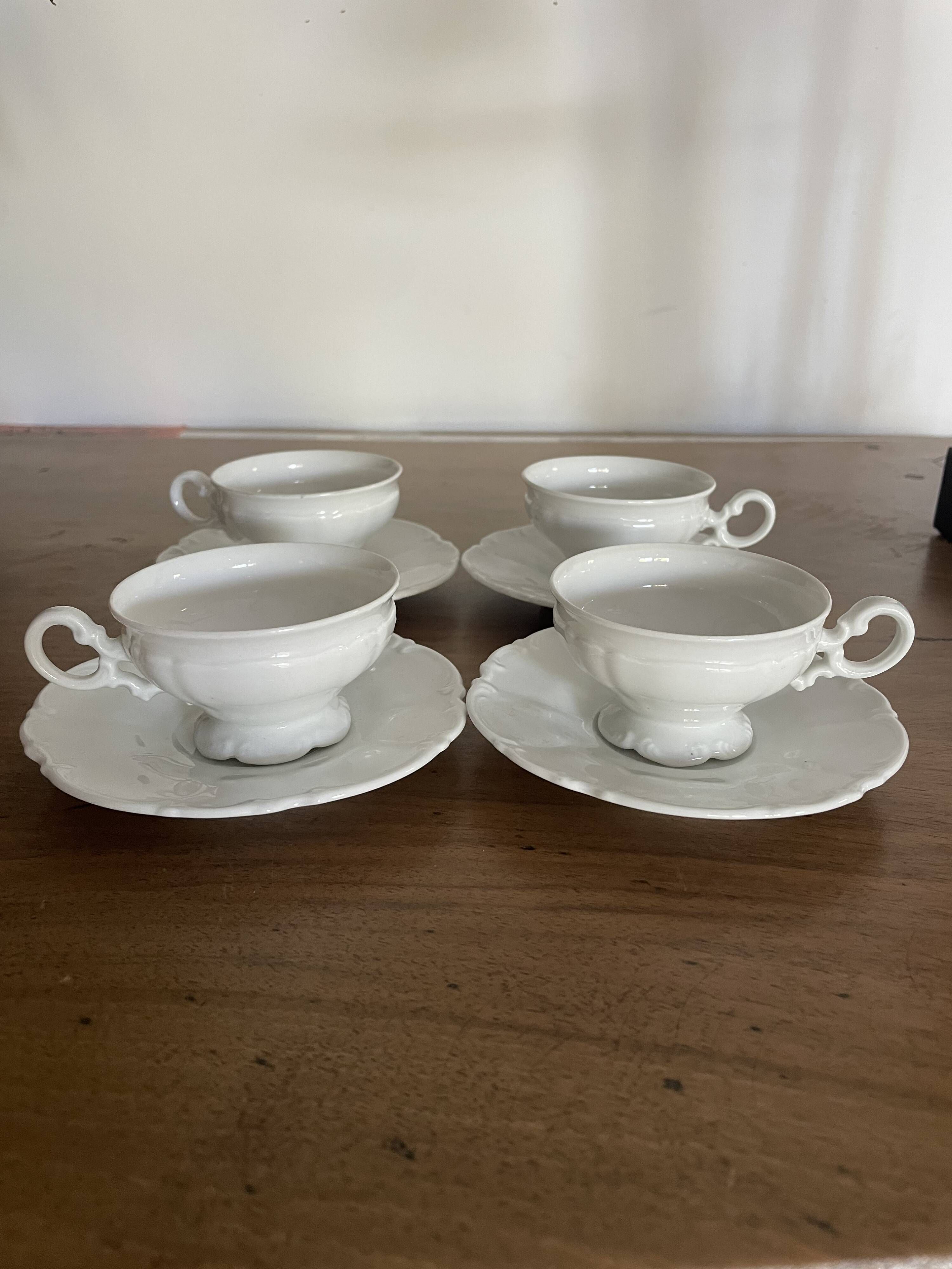 Set of 4 Hutschenreuther fine porcelain cups and saucers.