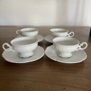 Set of 4 Hutschenreuther fine porcelain cups and saucers.
