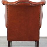 Elegant, smooth, and comfortable English Chesterfield wingback armchair in a beautiful classic color