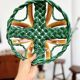 Woven green fruit bowl from the 1950s.
