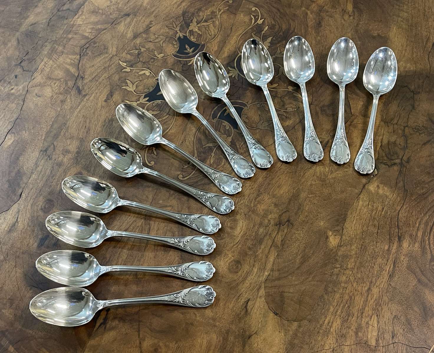 Series of 12 Christofle model Marly dessert spoons in silver metal