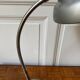 Industrial metal workshop lamp with a gooseneck.