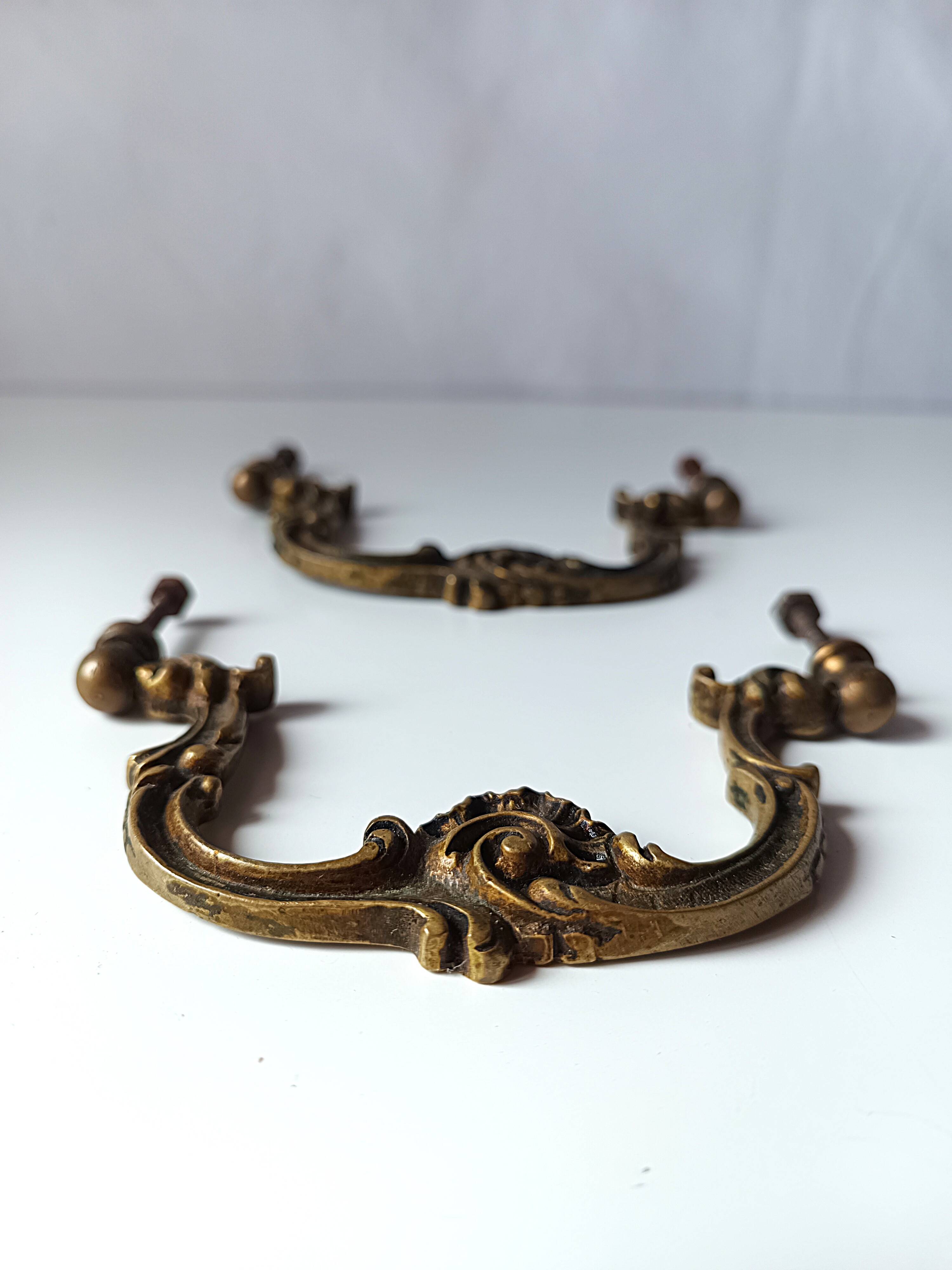 Antique pair of bronze drawer handles.