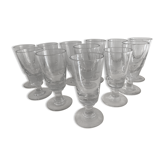 12 old glasses on foot at bistro or absinthe