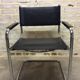 Chair leatherette and brass