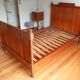Single wooden bed in pitch pine