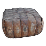 Set of 2 vintage ottomans in brown and black leather with Egyptian patterns from the 1970s.