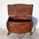 Old chest, carved wooden chest, curved chest on wheels, interior decoration