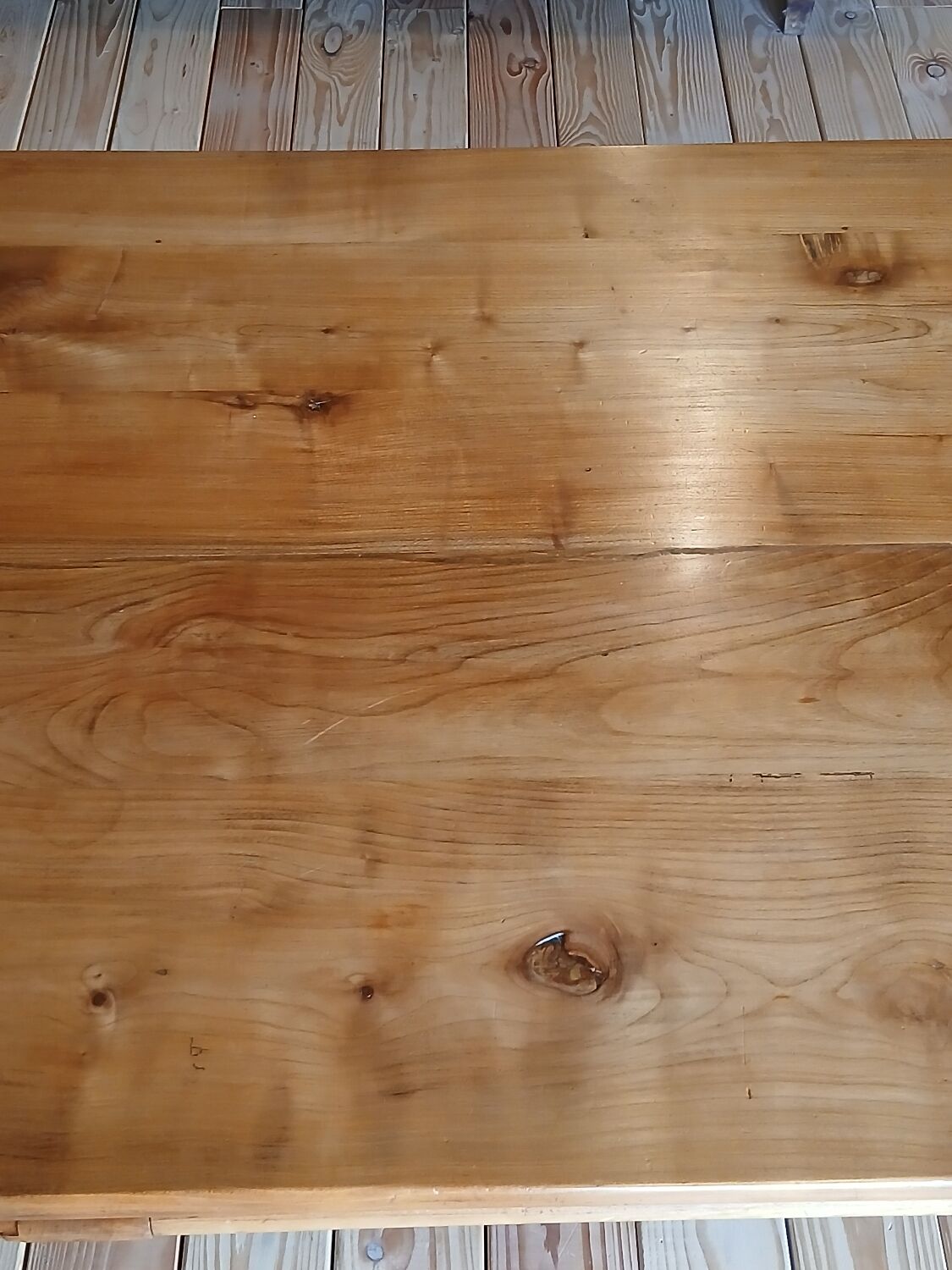 Elm farmhouse table with extensions for 6 to 10 people.