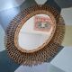 Oval rattan mirror