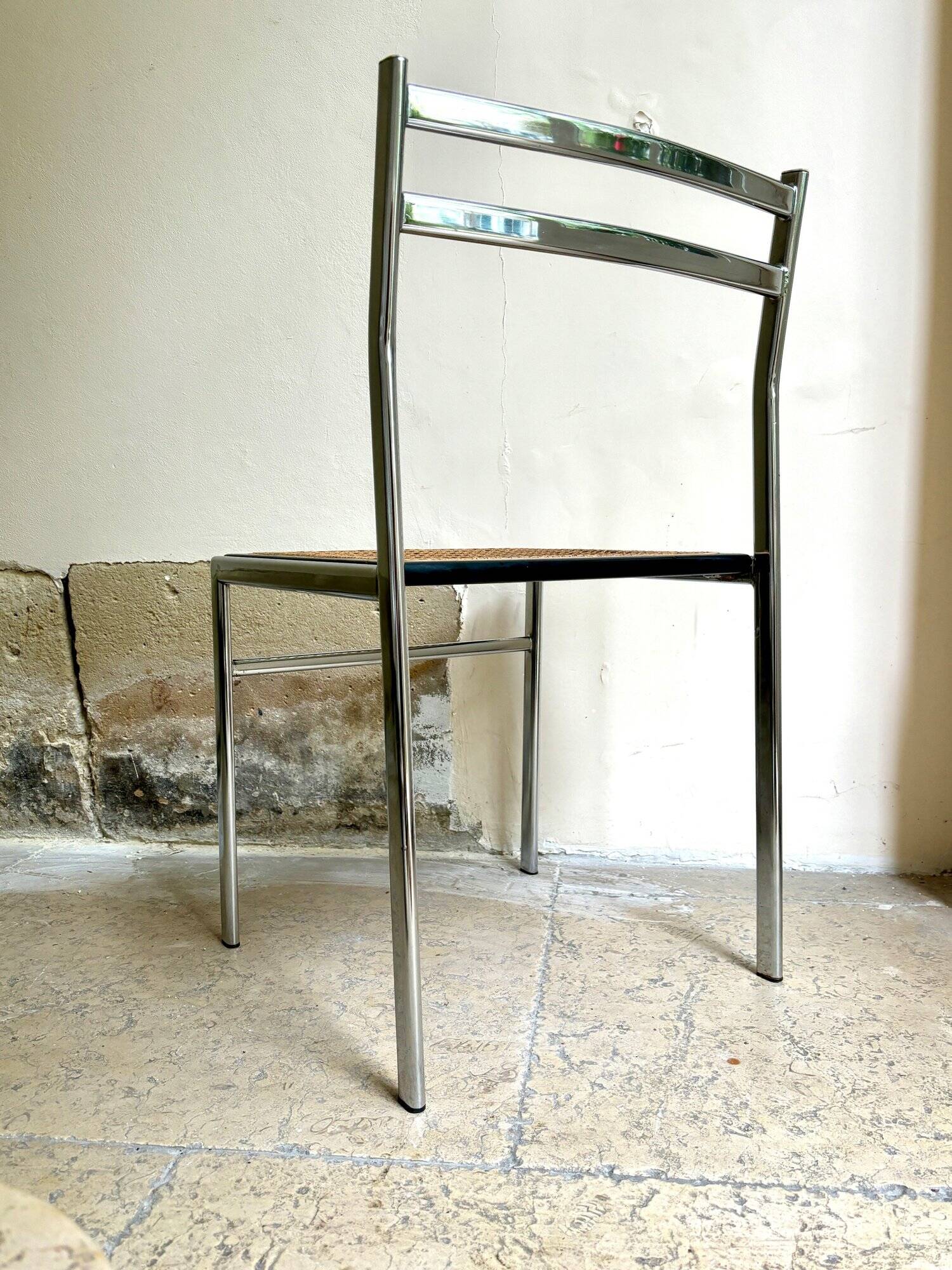 Chair in chrome metal, black wood and canework
