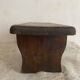 Old low stool made of solid wood
