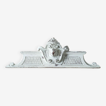 Old pediment in painted wood