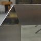 Designer mirror in brushed and chrome-plated stainless steel, beveled glass, 1970s