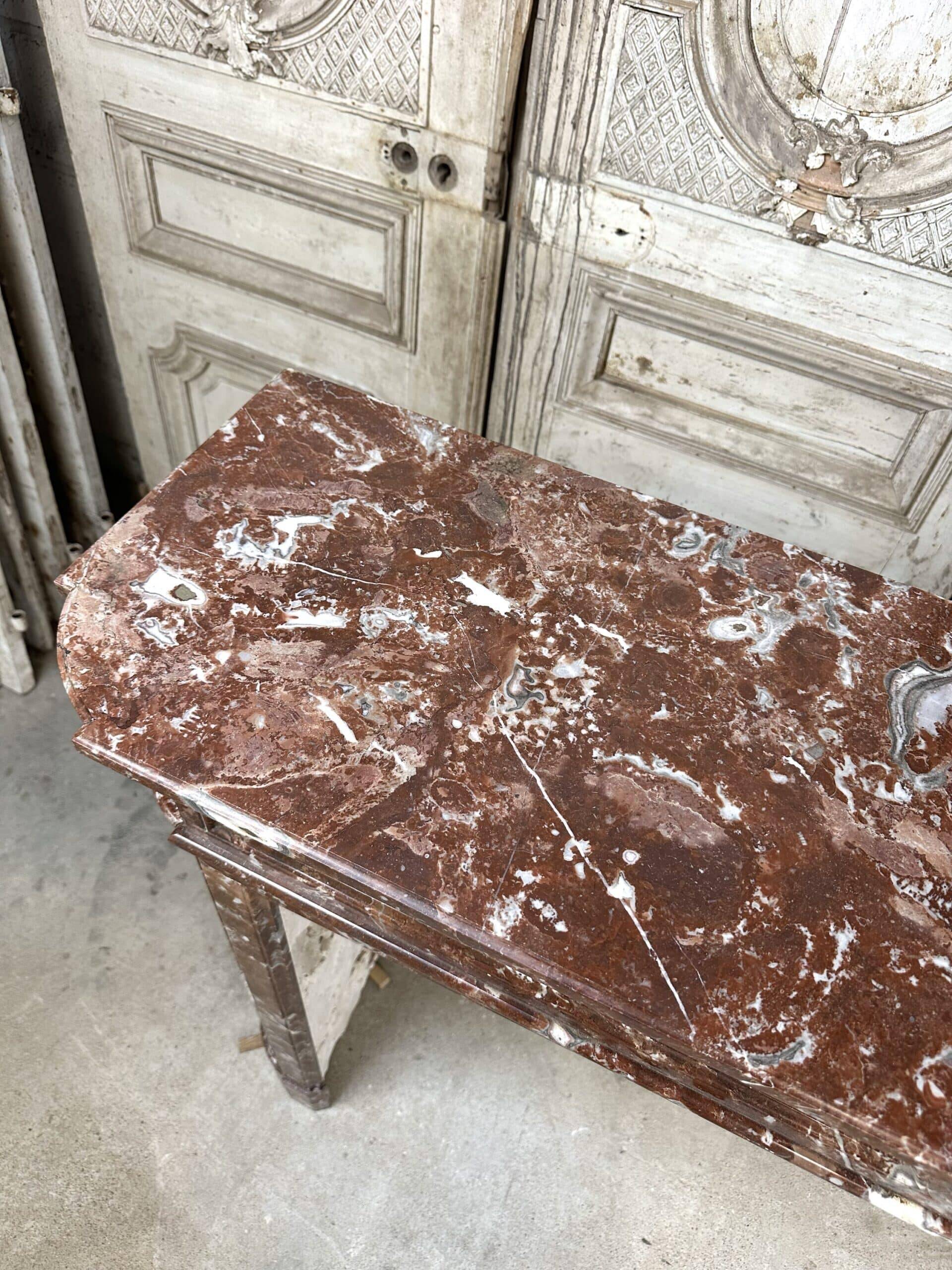 Red marble fireplace in the Louis XVI style, late 19th century