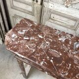 Red marble fireplace in the Louis XVI style, late 19th century