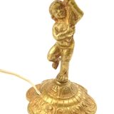 Lampe à poser cherubin en laiton.