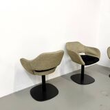 Series of six swivel chairs with an organic shell, patterned fabric and base.