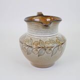 Glazed ceramic jug with plant decoration