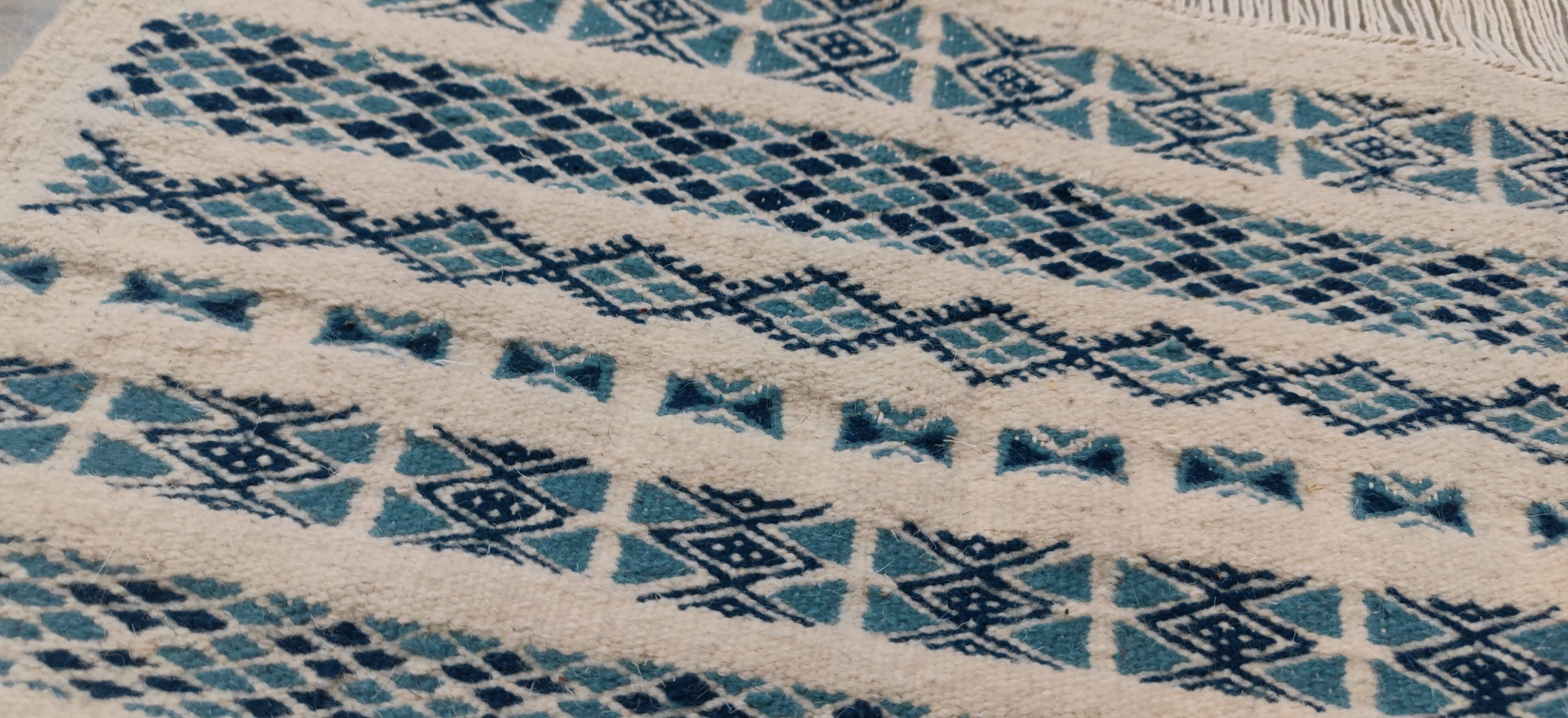 Traditional handmade white and blue carpet