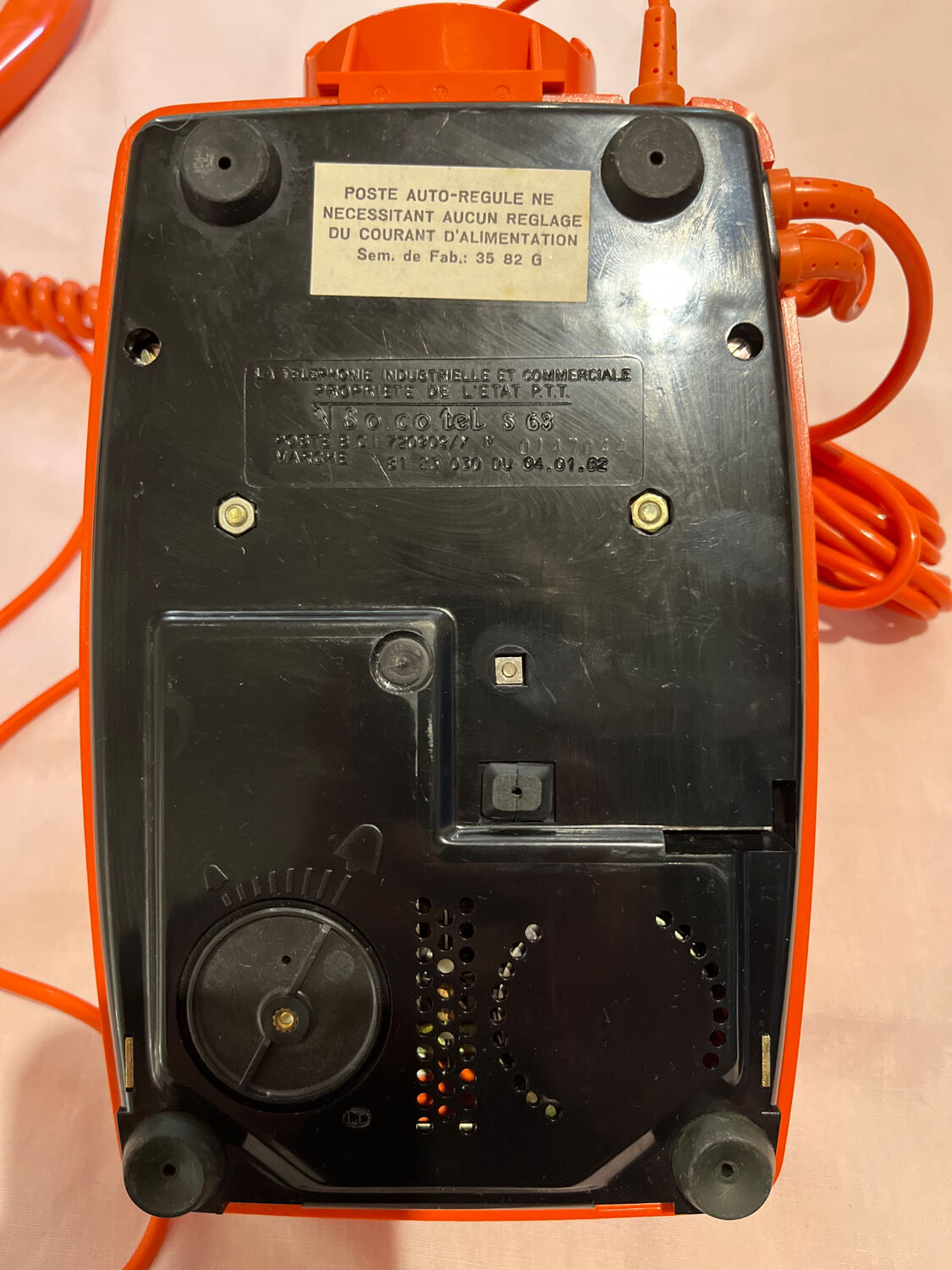 Orange vintage phone with socotel dial