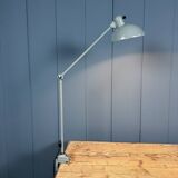 Grey two-arm Kaiser Idell clamp lamp model