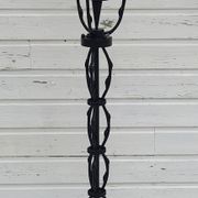 Black wrought iron floor lamp attributed to Gilbert Poillerat