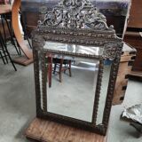 Mirror with embossed brass bead