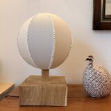 Handmade wooden ball lamp on a stand