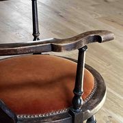 Windsor chair with comb back, stained wood and terracotta velvet.