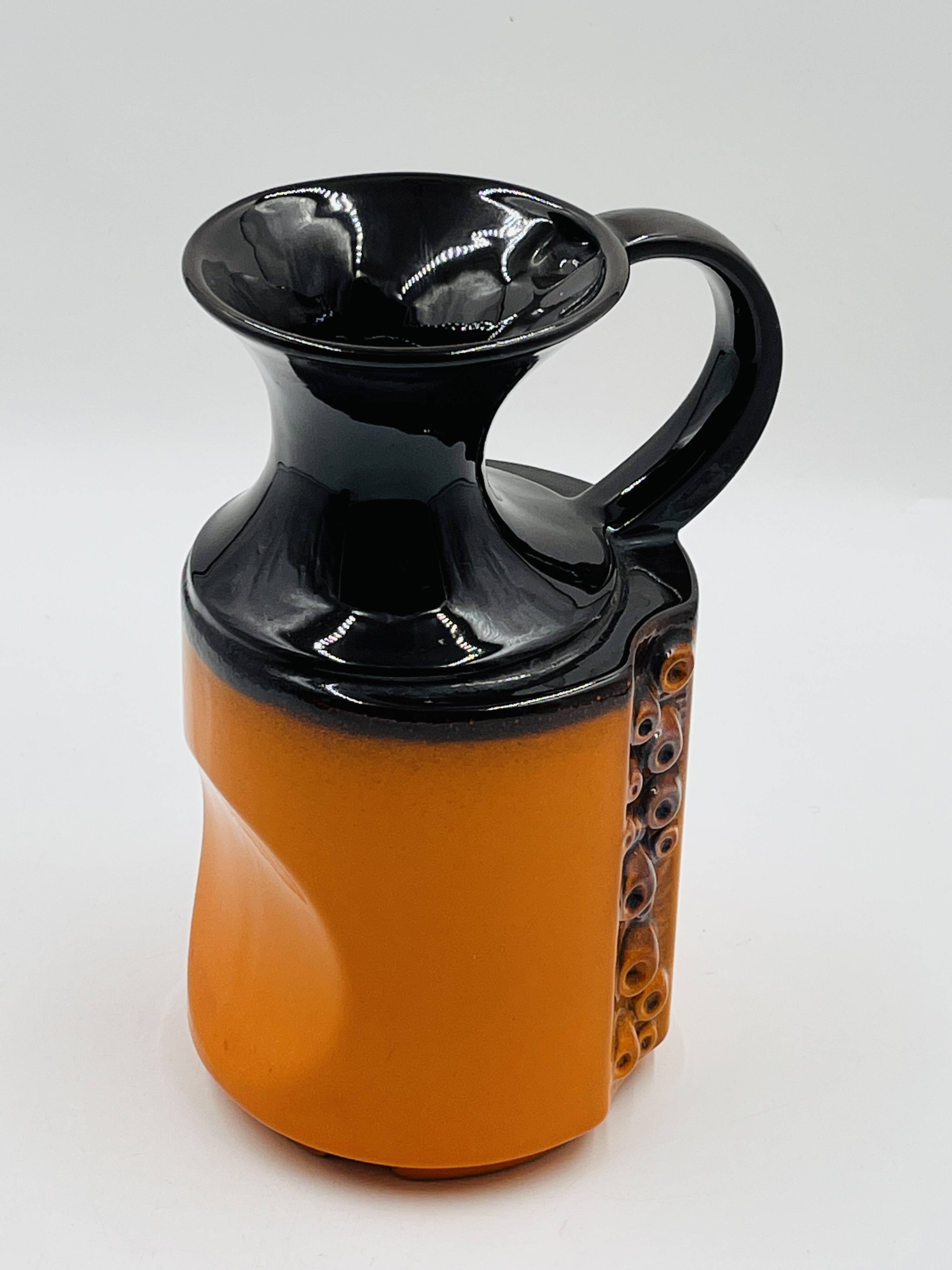 Modernist vase design, orange ceramic with relief cabochons from the 1970s.