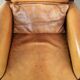 Cognac-coloured Art Deco design armchair made of sheepskin with a high back