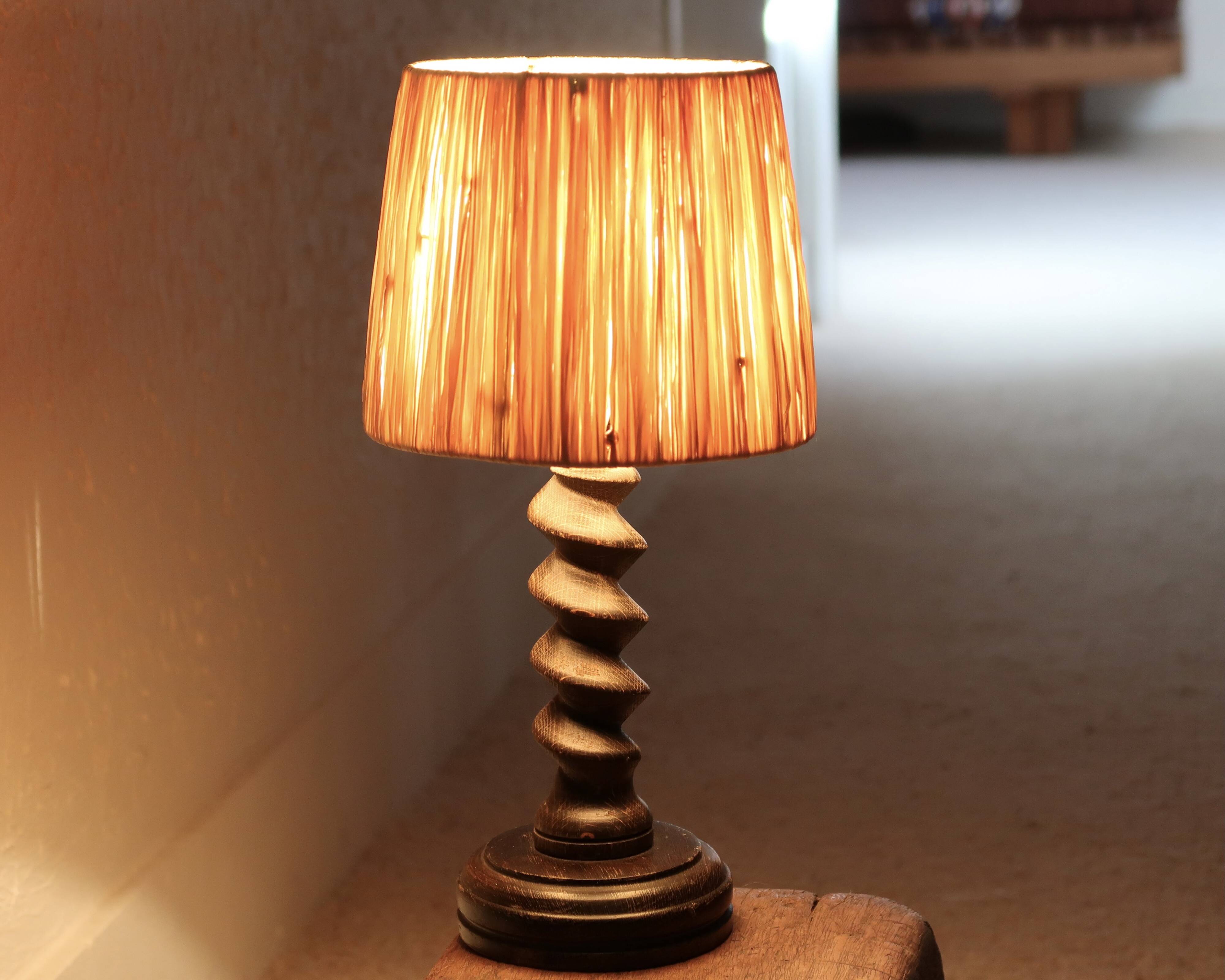 Wooden column lamp by Charles Dudouyt with raffia shade, 1940s.