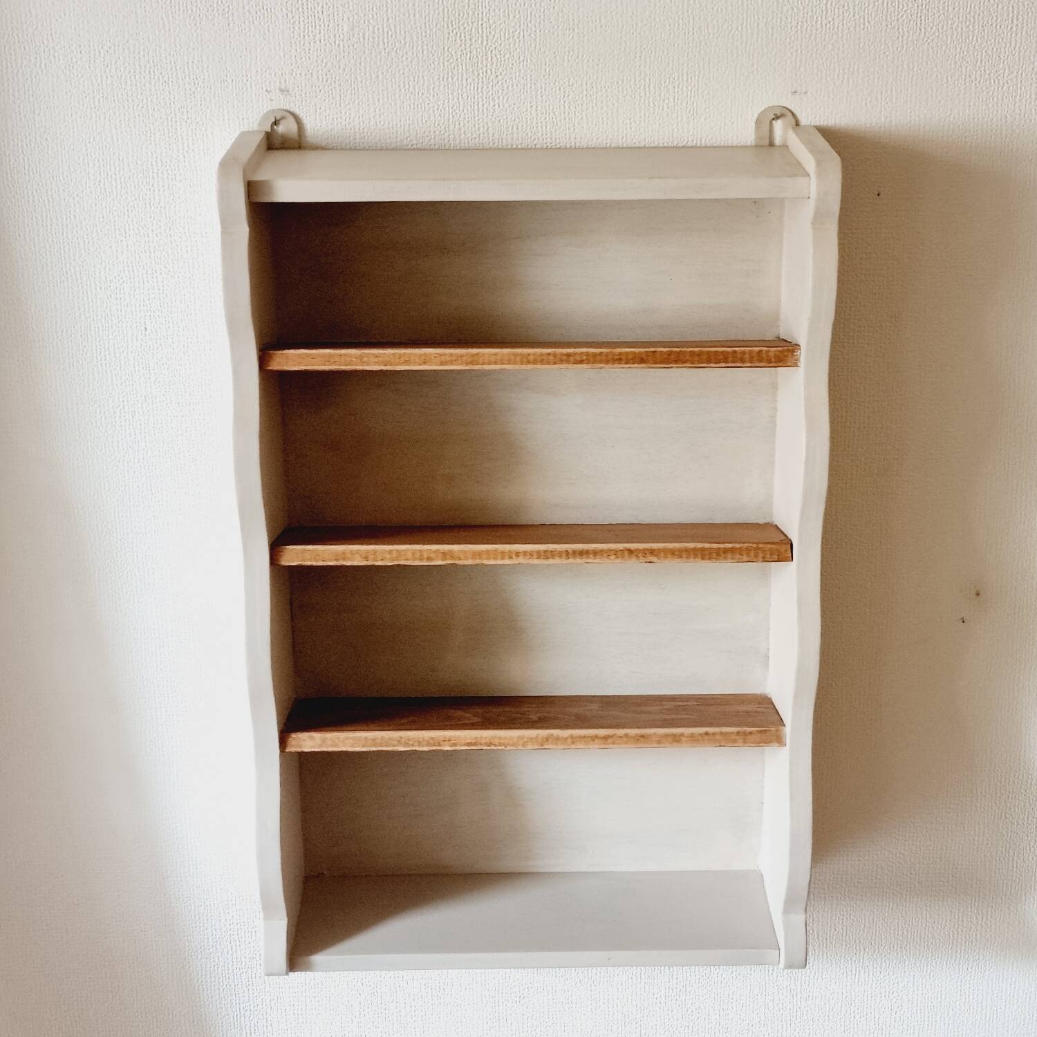 Linen-colored wooden shelf