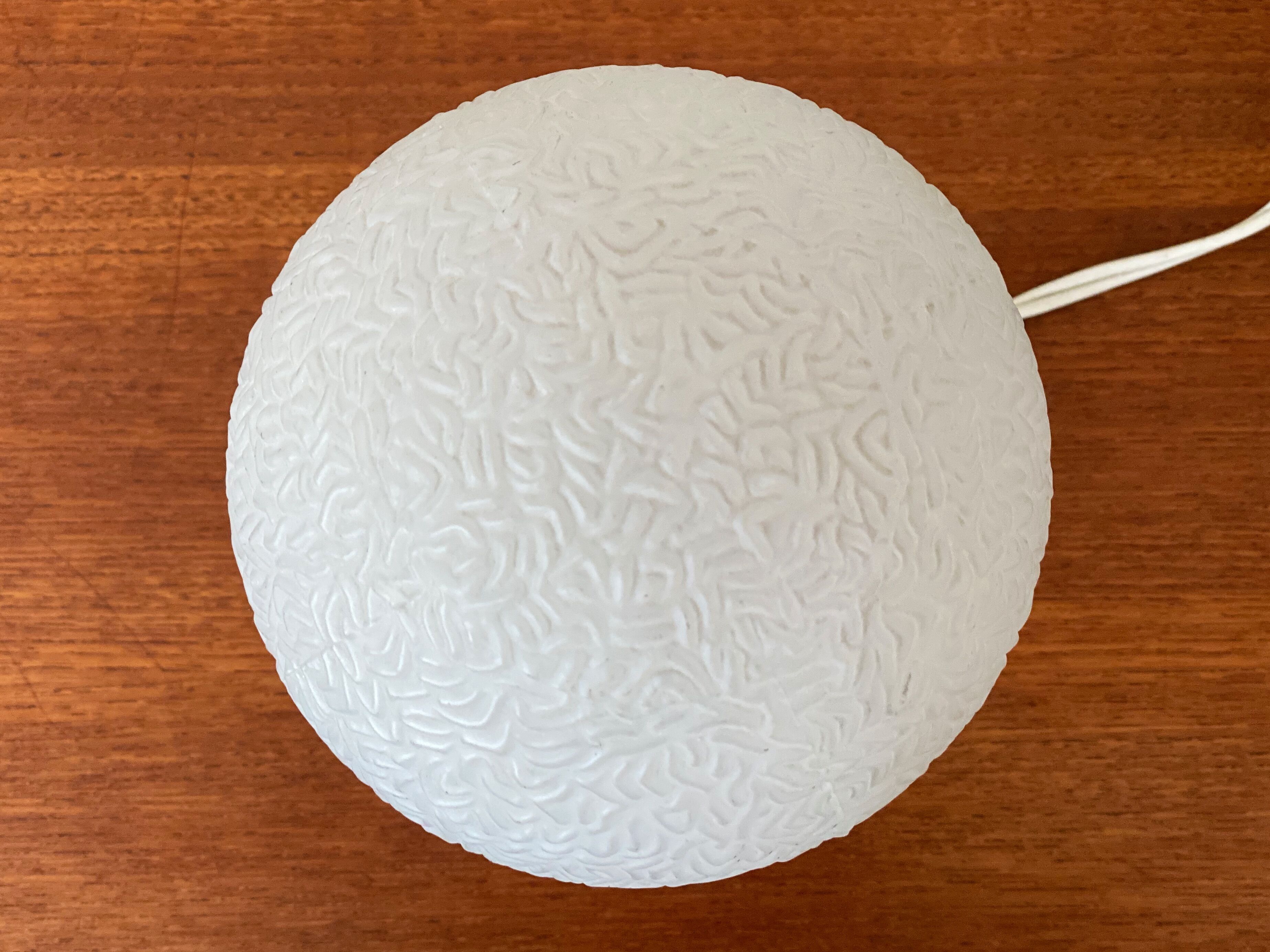 Orange vintage space age eyeball table lamp with a glass globe