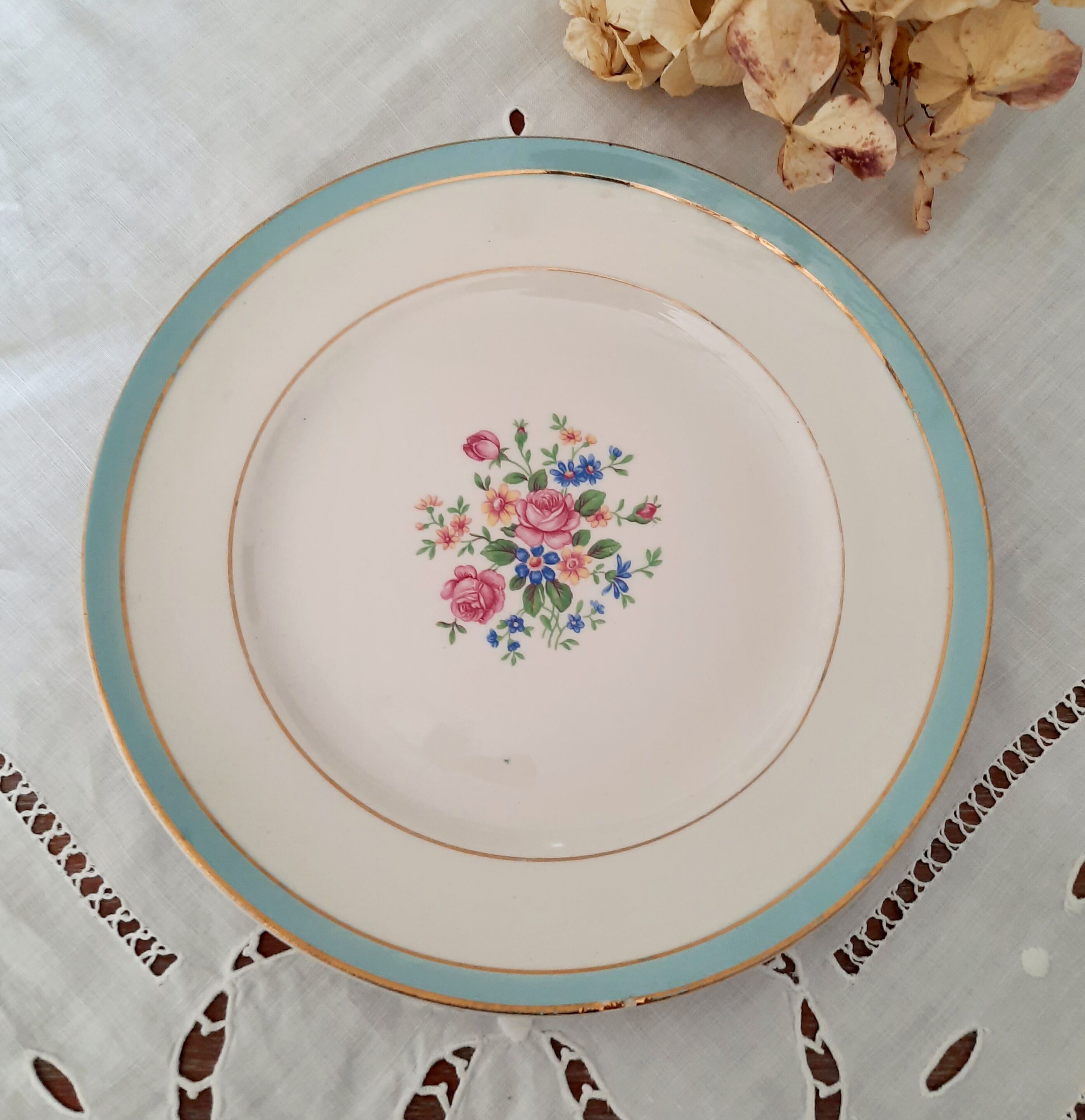 7 mismatched antique dessert plates accompanied by a pie dish