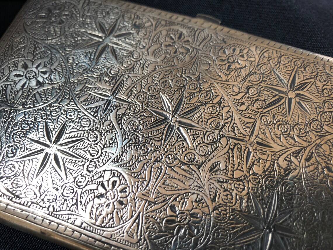 Chiseled bronze cigarette case from the late 19th century