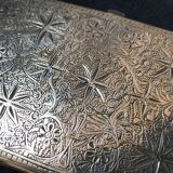 Chiseled bronze cigarette case from the late 19th century