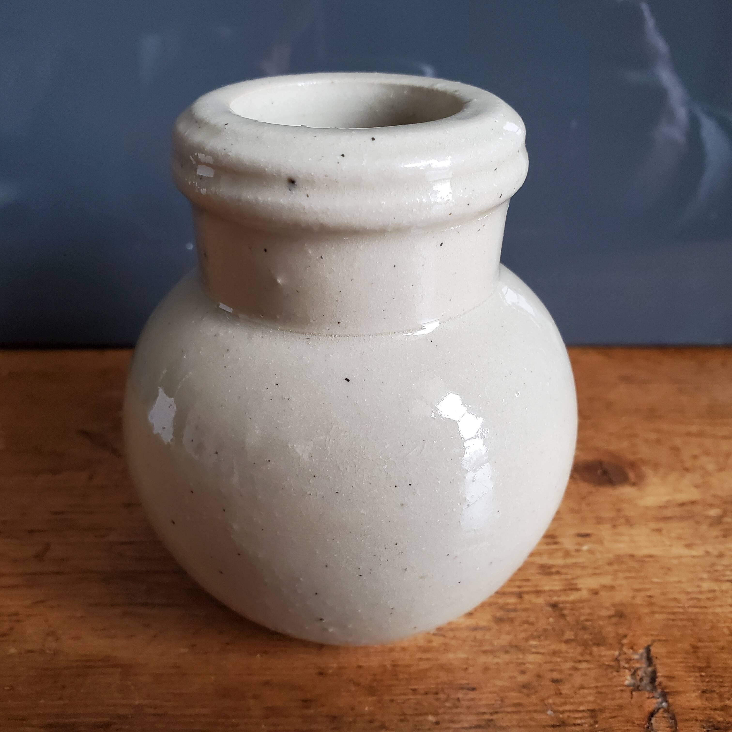 Small beige ball vase in glazed sandstone