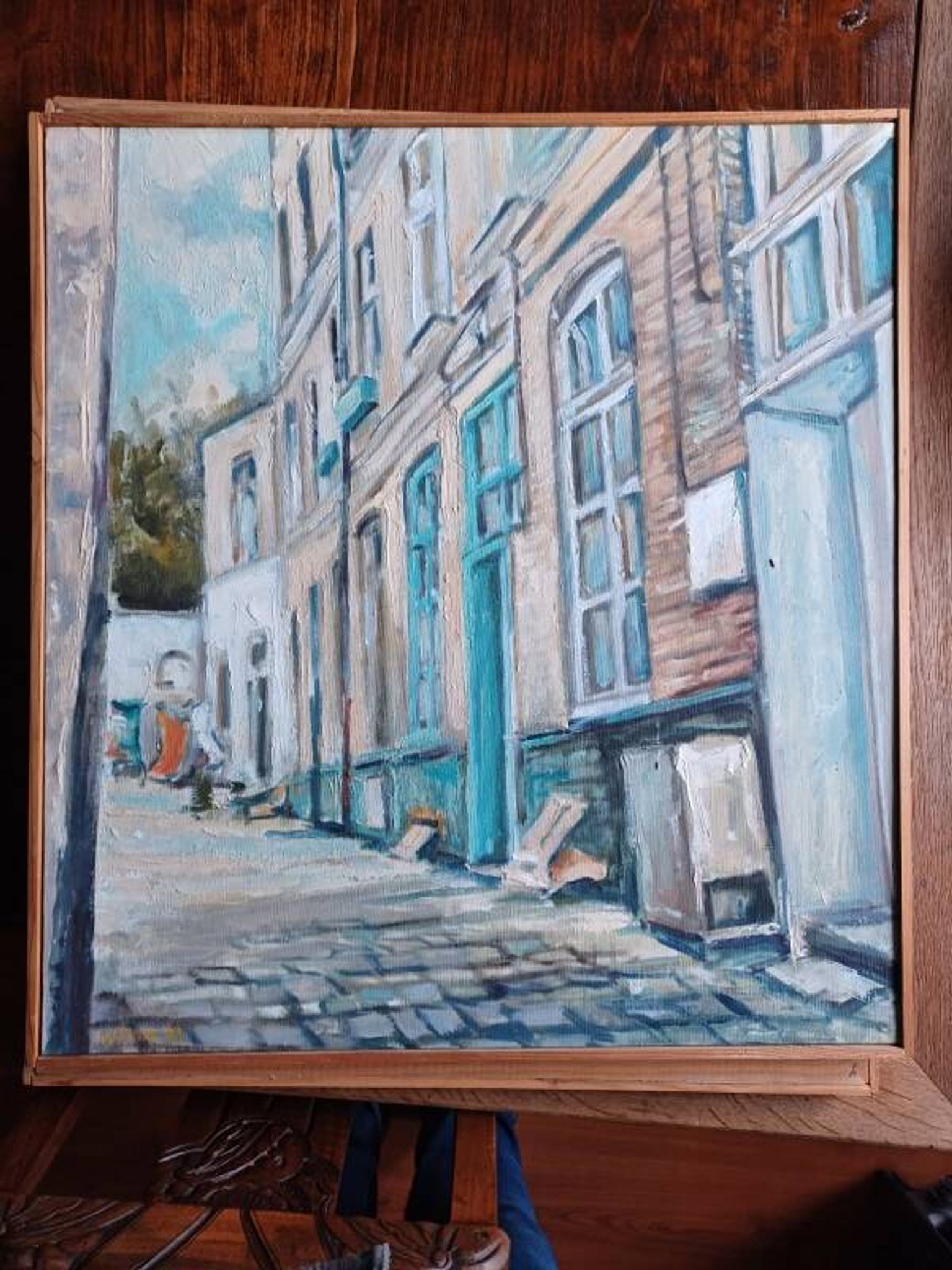 Signed painting depicting a courtyard in old Lille