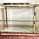 Coffee table with glass and gilded brass shelf France 1970