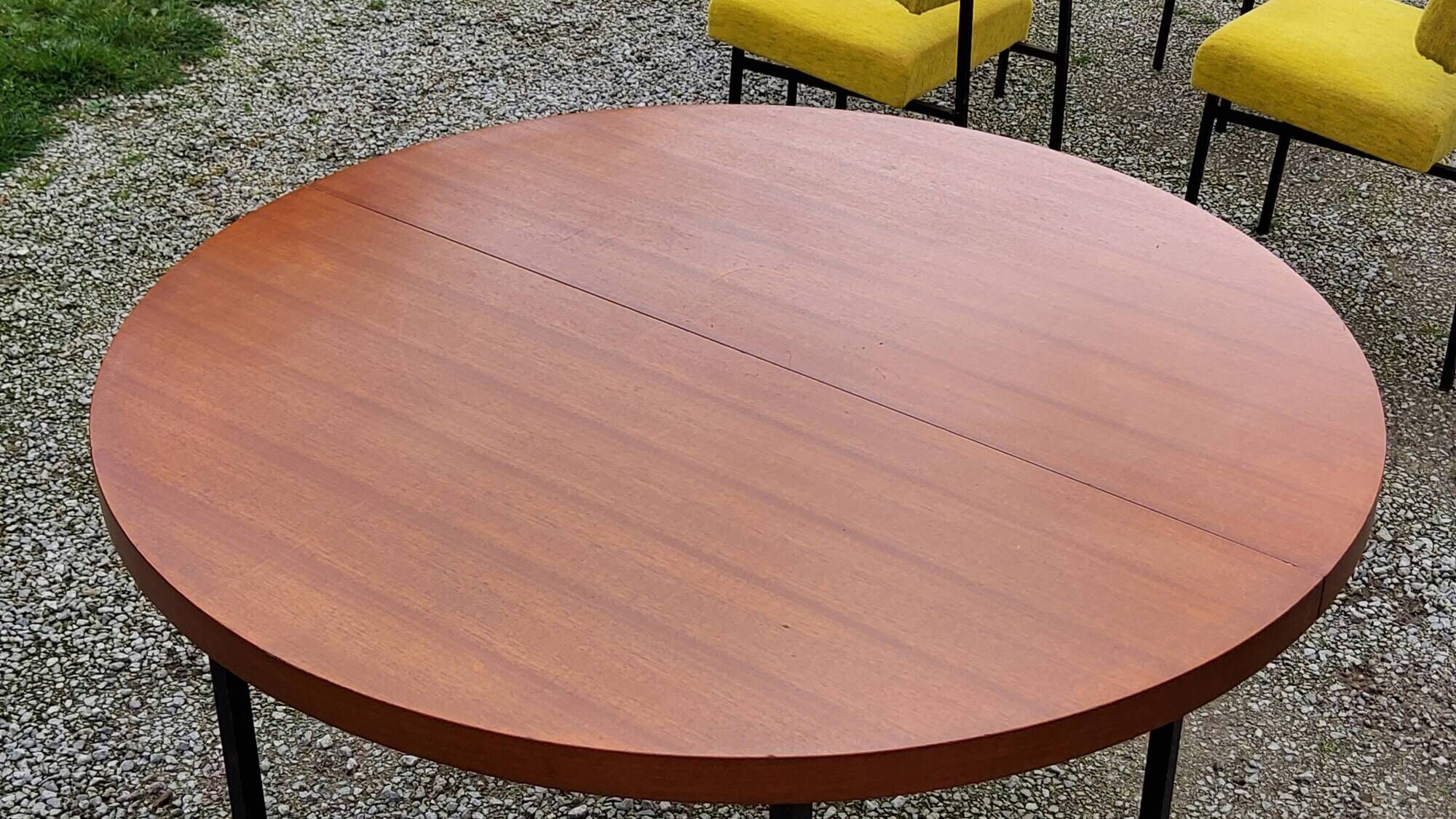 Vintage round table in blond mahogany by Gérard Guermonprez Editor Magnani, metal base